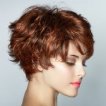 Beautiful young woman with short brown edgy haircut.