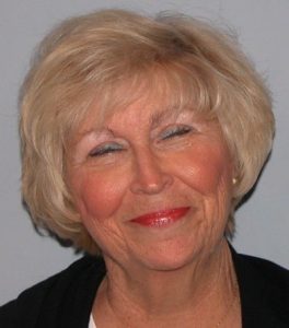 Short wispy hairstyle with fringe on women over 70.