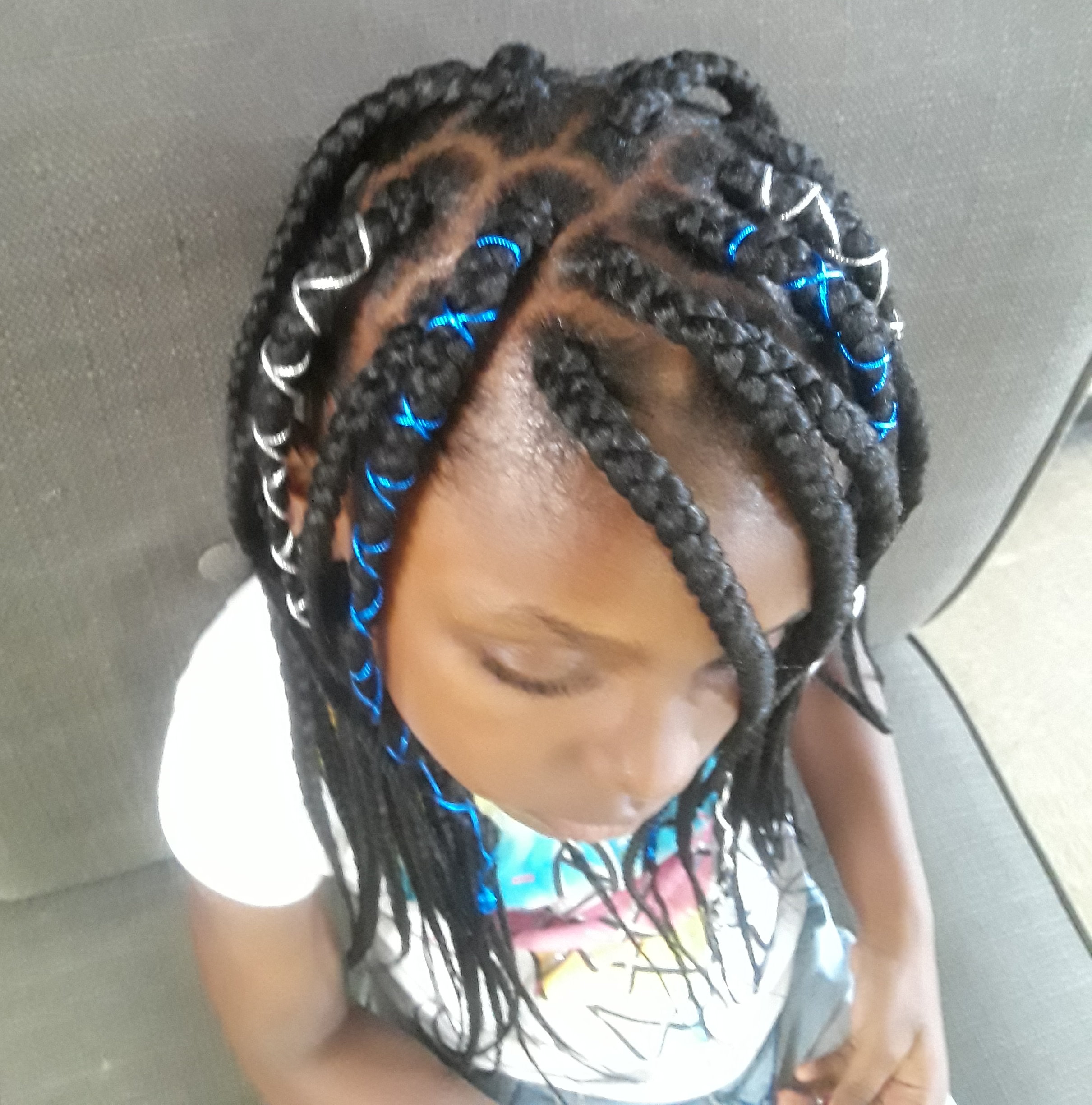 Young Girl box Braids with ribbon accents