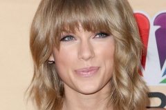 Taylor Swift with full fringe medium length hairstyle